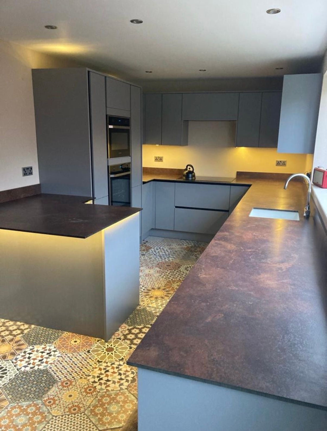 Copper Flow Compact Laminate Kitchen – Bold, Modern Finish with Dust Grey Doors